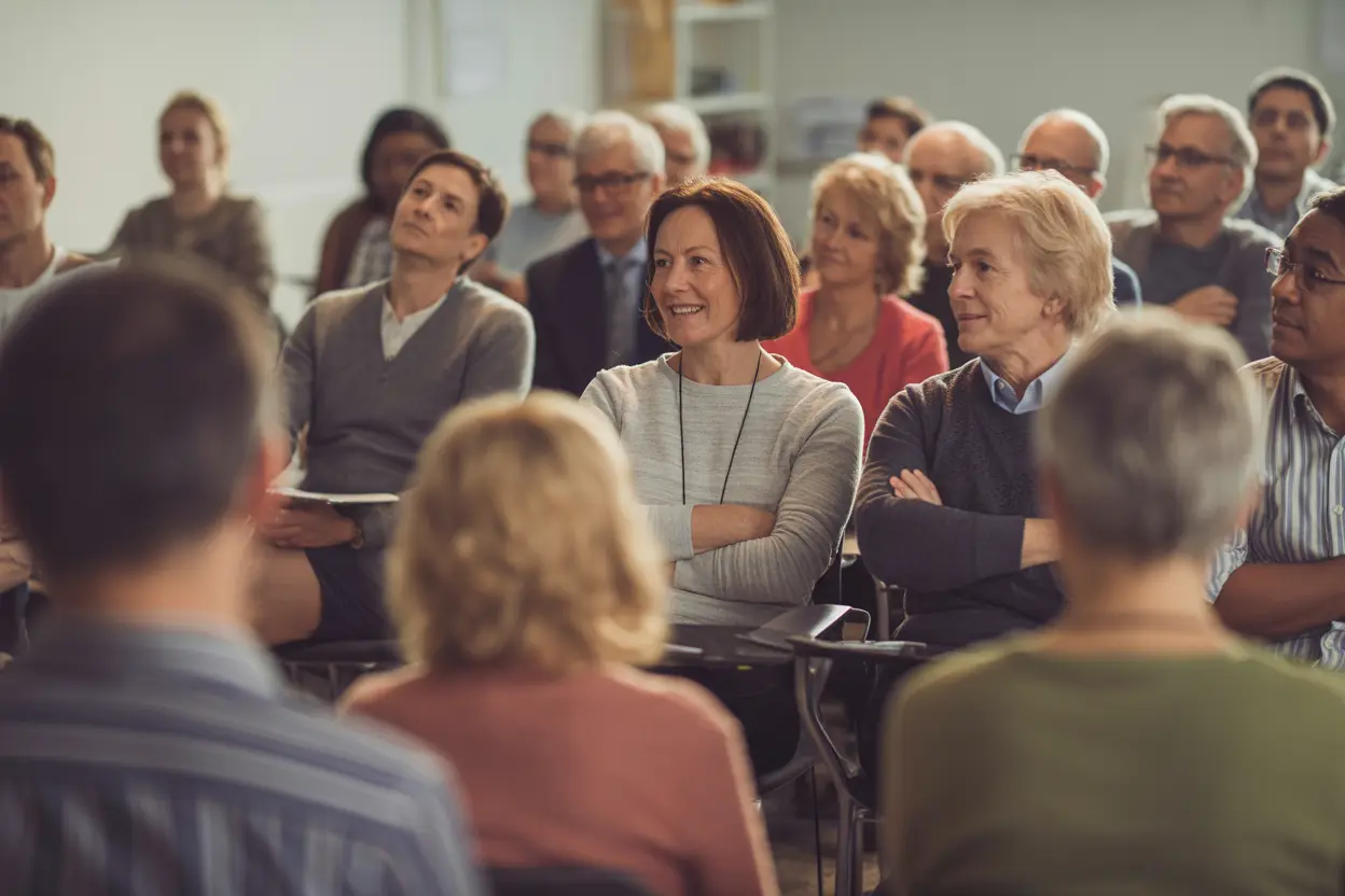 A community classroom with a diverse group of adults attending a training session.