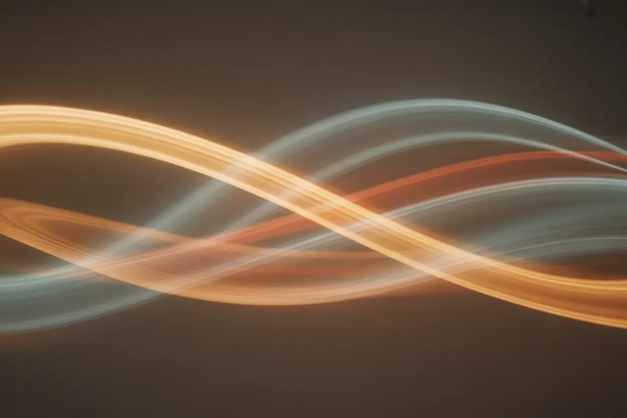 An abstract image with soft blurs of light in warm and cool tones, representing sensory confusion and distorted perception.