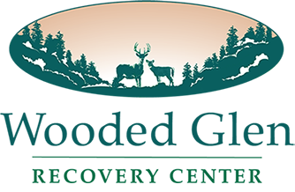 Wooded Glen Recovery Center - Addiction treatment center logo in Henryville, Indiana